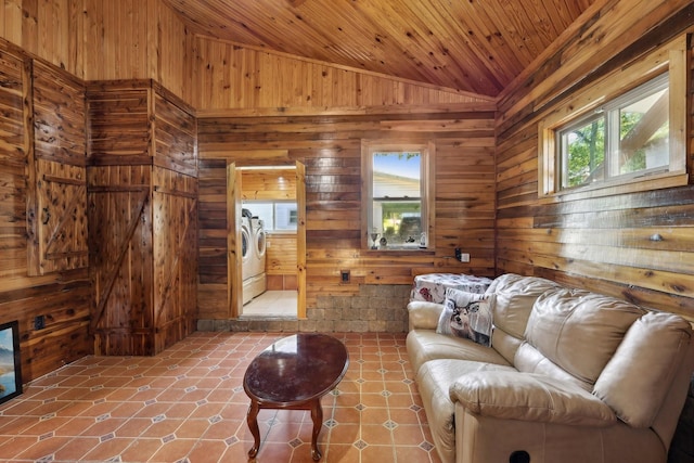 102 Nall Ave, Centerville, TN 37033 - living room with washing machine and clothes dryer, wooden walls, vaulted ceiling, wood ceiling, and tile patterned floors