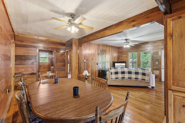 102 Nall Ave, Centerville, TN 37033 - dining room with a ceiling fan, wooden walls, light wood finished floors, and beamed ceiling