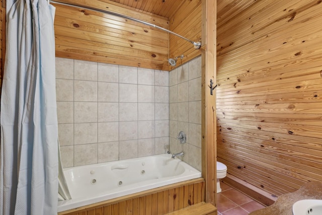 102 Nall Ave, Centerville, TN 37033 - full bathroom featuring a combined bath / shower with jetted tub, toilet, tile patterned floors, and wooden walls