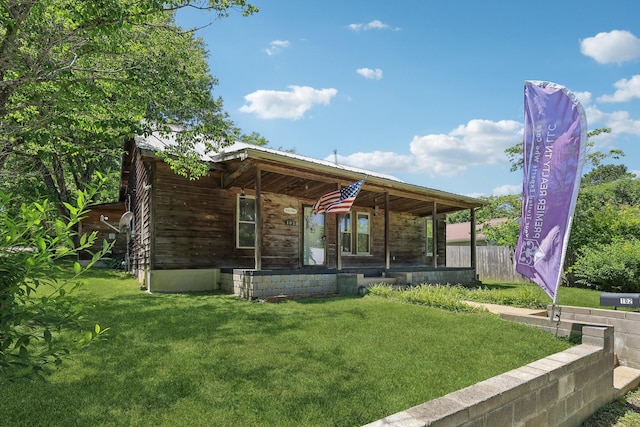 102 Nall Ave, Centerville, TN 37033 - view of front facade with a front yard and a porch