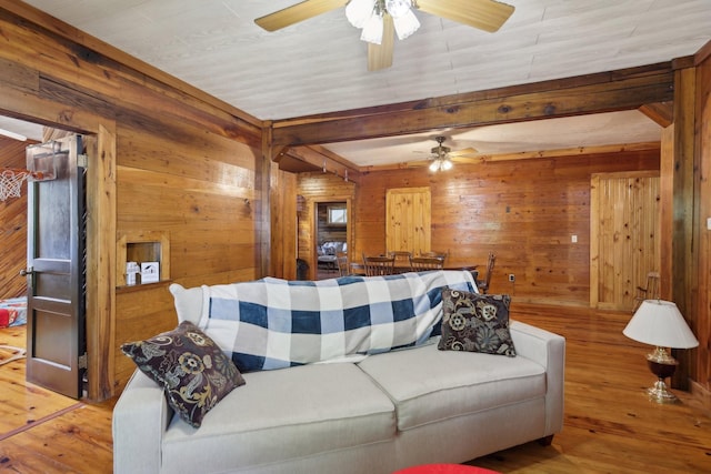 102 Nall Ave, Centerville, TN 37033 - living area featuring ceiling fan, wooden walls, wood-type flooring, and beamed ceiling
