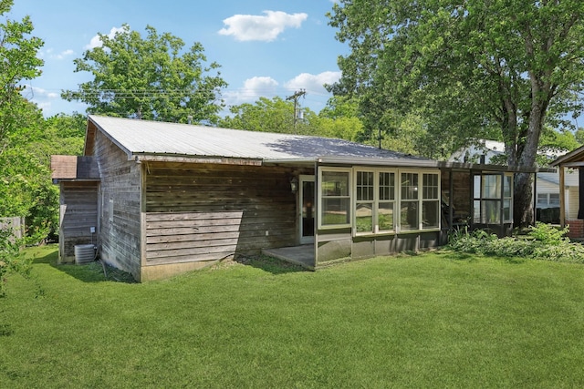 102 Nall Ave, Centerville, TN 37033 - rear view of property with a yard and central AC