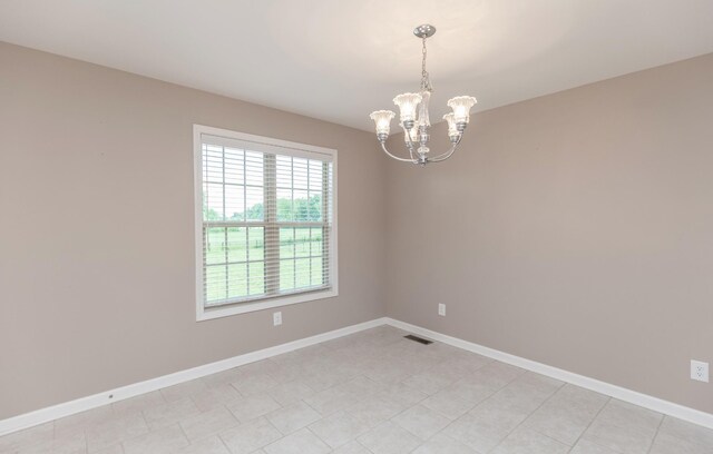 138 Beaver Creek Dr, Portland, TN 37148 - spare room featuring a chandelier and baseboards