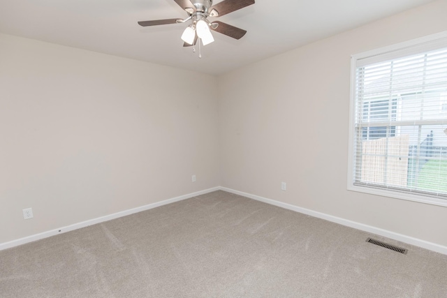 138 Beaver Creek Dr, Portland, TN 37148 - spare room featuring light colored carpet, baseboards, and a ceiling fan