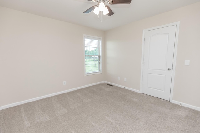 138 Beaver Creek Dr, Portland, TN 37148 - spare room with light colored carpet, ceiling fan, and baseboards