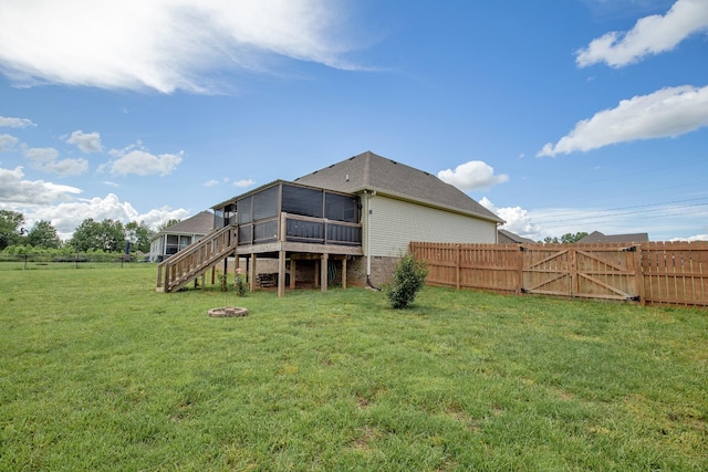 138 Beaver Creek Dr, Portland, TN 37148 - back of house with a sunroom, stairway, and a gate