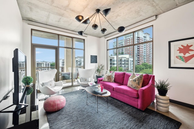 1510 Demonbreun St Unit 711, Nashville, TN 37203 - living room with healthy amount of natural light, a chandelier, and a city view