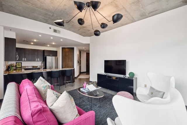 1510 Demonbreun St Unit 711, Nashville, TN 37203 - living area featuring a chandelier and recessed lighting