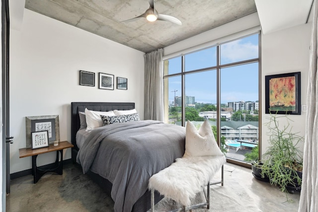 1510 Demonbreun St Unit 711, Nashville, TN 37203 - bedroom featuring multiple windows, a view of city, concrete floors, and access to outside