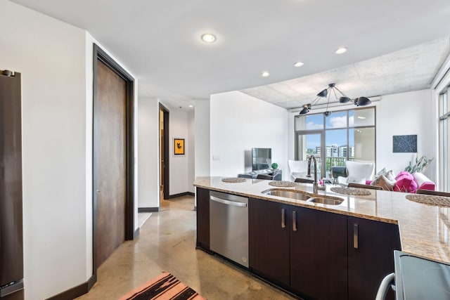 1510 Demonbreun St Unit 711, Nashville, TN 37203 - kitchen featuring stainless steel appliances, a sink, finished concrete floors, open floor plan, and light stone countertops