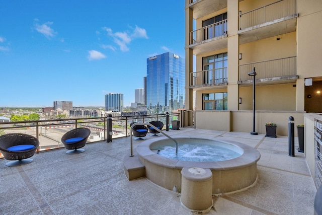 1510 Demonbreun St Unit 711, Nashville, TN 37203 - view of patio featuring a skyline view and an in-ground hot tub