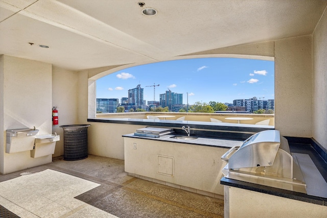 1510 Demonbreun St Unit 711, Nashville, TN 37203 - view of patio featuring a view of city, area for grilling, a sink, and a balcony