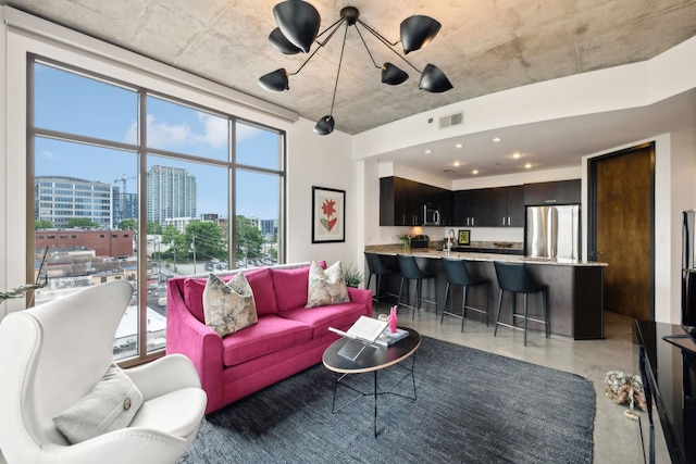 1510 Demonbreun St Unit 711, Nashville, TN 37203 - living area featuring a city view, healthy amount of natural light, and concrete floors