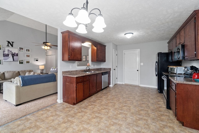 1382 Whitt Ln, Clarksville, TN 37042 - kitchen featuring appliances with stainless steel finishes, open floor plan, a chandelier, ceiling fan, and a sink