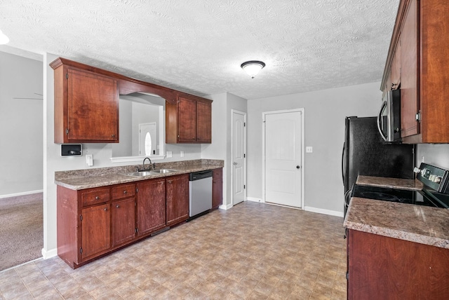 1382 Whitt Ln, Clarksville, TN 37042 - kitchen featuring stainless steel appliances, a sink, baseboards, a textured ceiling, and light floors