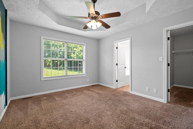 1382 Whitt Ln, Clarksville, TN 37042 - unfurnished bedroom featuring a textured ceiling, carpet, baseboards, a spacious closet, and a closet