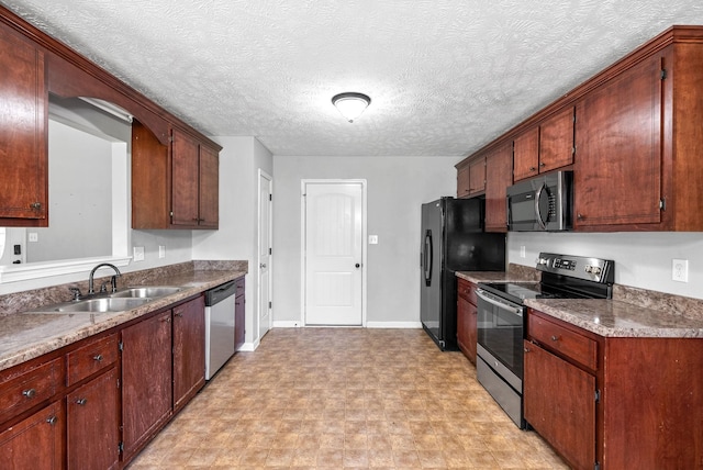 1382 Whitt Ln, Clarksville, TN 37042 - kitchen with appliances with stainless steel finishes, a sink, light floors, and baseboards