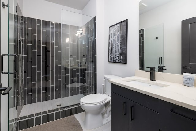 303 31st Ave N Unit 305, Nashville, TN 37203 - full bathroom featuring toilet, vanity, a shower stall, and tile patterned flooring