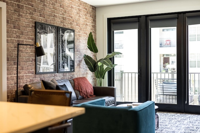 303 31st Ave N Unit 305, Nashville, TN 37203 - living room with brick wall and healthy amount of natural light