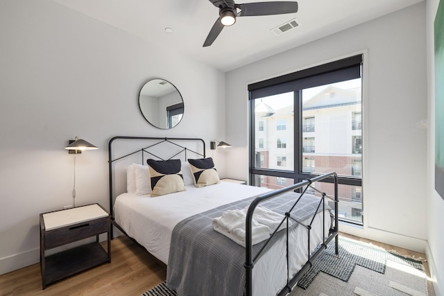 303 31st Ave N Unit 305, Nashville, TN 37203 - bedroom featuring wood finished floors, ceiling fan, and baseboards