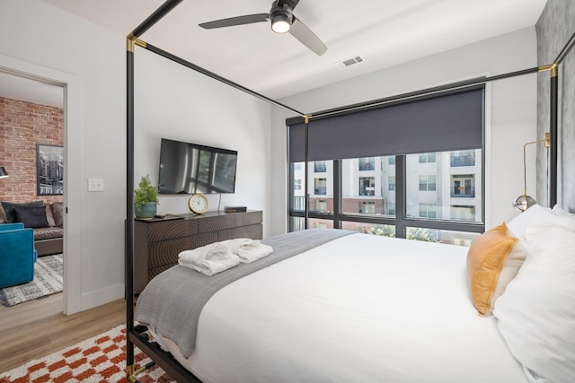 303 31st Ave N Unit 305, Nashville, TN 37203 - bedroom with wood finished floors and a ceiling fan