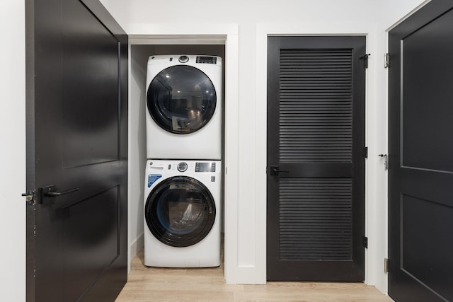 303 31st Ave N Unit 305, Nashville, TN 37203 - laundry room featuring stacked washer and clothes dryer and light wood finished floors