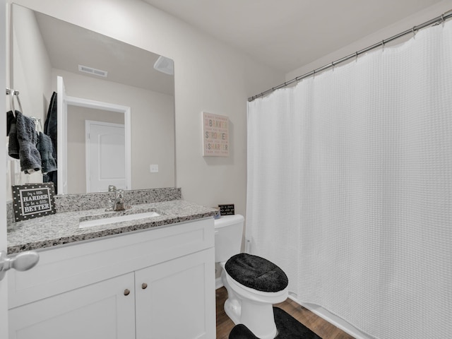 108 Birdie Ct, Dickson, TN 37055 - full bathroom with wood finished floors, toilet, and vanity