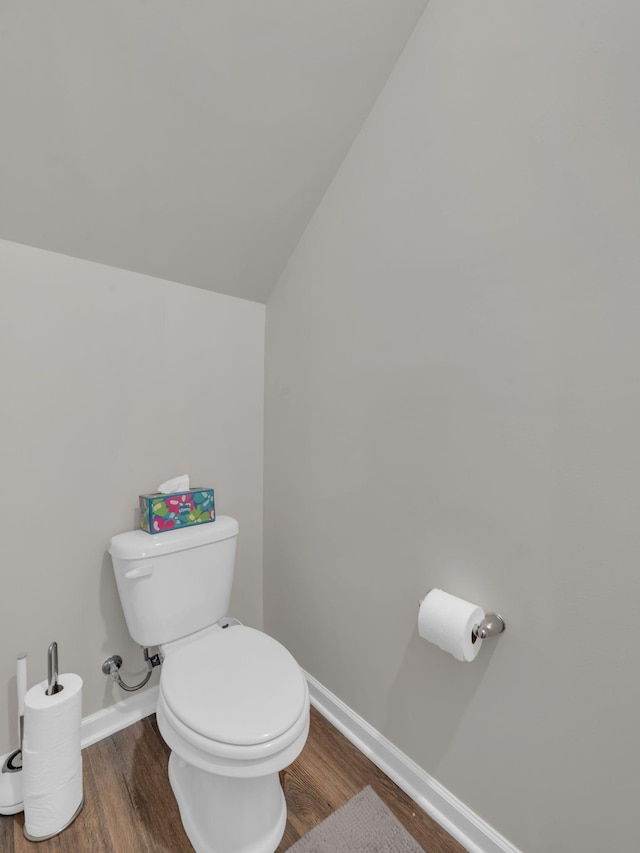 108 Birdie Ct, Dickson, TN 37055 - bathroom with wood finished floors, toilet, baseboards, and lofted ceiling