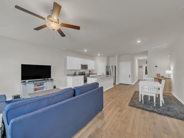 108 Birdie Ct, Dickson, TN 37055 - living room featuring wood finished floors, a ceiling fan, baseboards, and recessed lighting