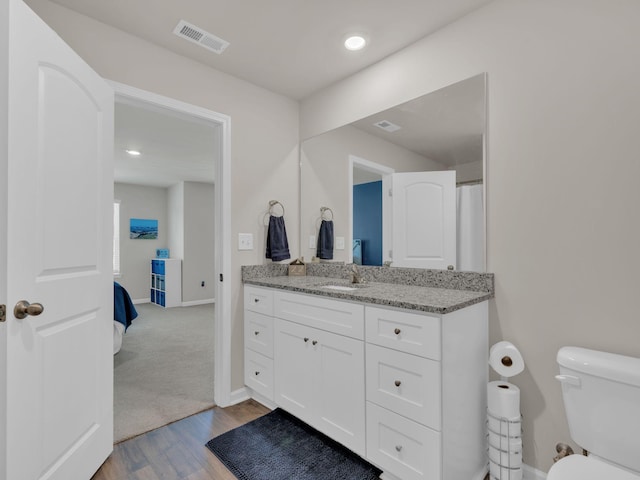 108 Birdie Ct, Dickson, TN 37055 - full bath with vanity, toilet, wood finished floors, baseboards, and recessed lighting