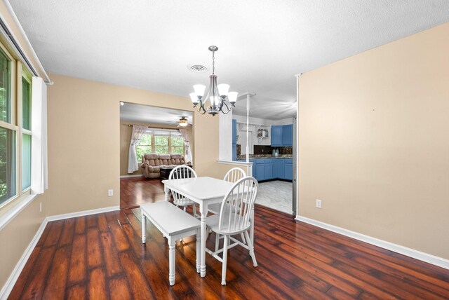 160 Terrapin Run Rd, Dover, TN 37058 - dining area featuring a chandelier, dark wood finished floors, and baseboards