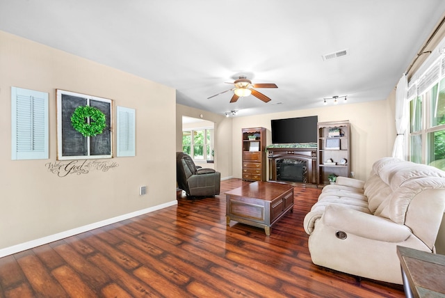 160 Terrapin Run Rd, Dover, TN 37058 - living room featuring dark wood-style floors, baseboards, a ceiling fan, and a fireplace