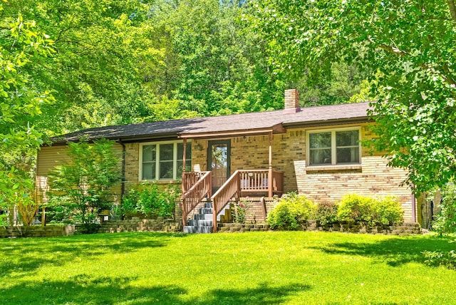 160 Terrapin Run Rd, Dover, TN 37058 - view of front facade with a front lawn, a chimney, and brick siding