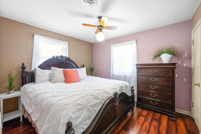 160 Terrapin Run Rd, Dover, TN 37058 - bedroom with multiple windows, dark wood-type flooring, baseboards, ceiling fan, and a textured ceiling
