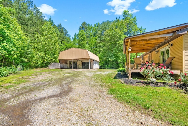 160 Terrapin Run Rd, Dover, TN 37058 - view of yard with a detached garage, an outbuilding, and a wooden deck