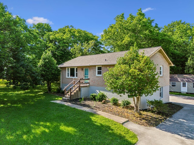 221 Cedar Creek Dr, Mount Juliet, TN 37122 - view of front of house with brick siding, a front yard, and driveway