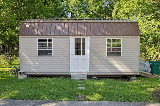 221 Cedar Creek Dr, Mount Juliet, TN 37122 - view of front of house with metal roof, an outdoor structure, a front yard, entry steps, and a gambrel roof