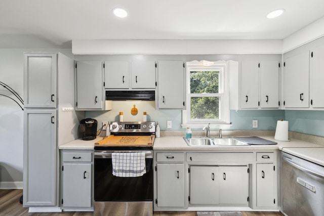 221 Cedar Creek Dr, Mount Juliet, TN 37122 - kitchen with stainless steel electric range, under cabinet range hood, a sink, light countertops, and recessed lighting