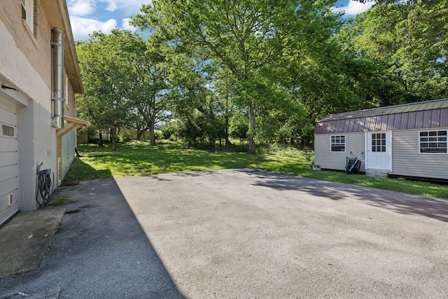 221 Cedar Creek Dr, Mount Juliet, TN 37122 - view of patio / terrace with an outdoor structure and view of wooded area