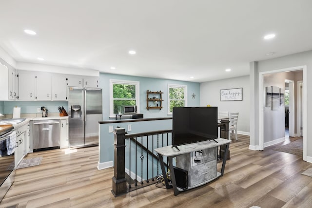 221 Cedar Creek Dr, Mount Juliet, TN 37122 - kitchen featuring stainless steel appliances, light wood finished floors, recessed lighting, white cabinetry, and baseboards