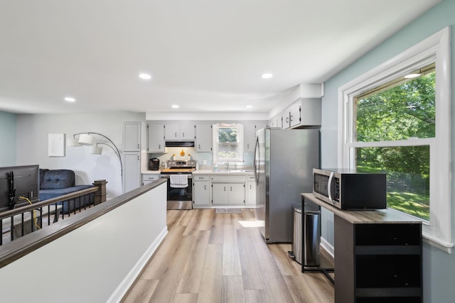 221 Cedar Creek Dr, Mount Juliet, TN 37122 - kitchen featuring stainless steel appliances, light wood-style flooring, recessed lighting, white cabinetry, and a sink