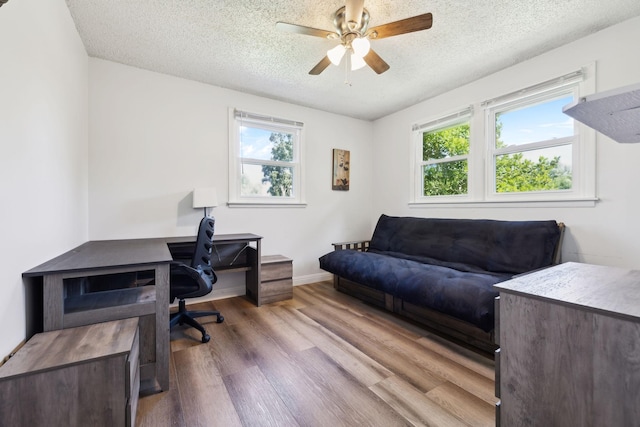 221 Cedar Creek Dr, Mount Juliet, TN 37122 - home office featuring wood finished floors, healthy amount of natural light, a textured ceiling, ceiling fan, and baseboards
