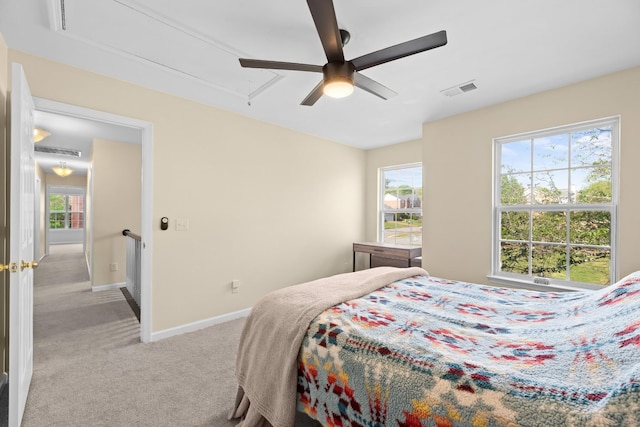 6712 Cold Stream Dr, Nashville, TN 37221 - carpeted bedroom with attic access, baseboards, multiple windows, and a ceiling fan