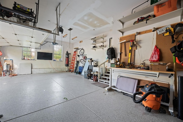 6712 Cold Stream Dr, Nashville, TN 37221 - garage with a workshop area and a garage door opener