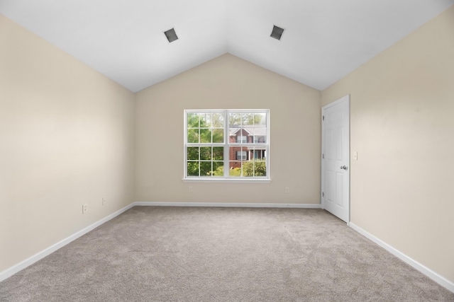 6712 Cold Stream Dr, Nashville, TN 37221 - carpeted empty room with baseboards and vaulted ceiling