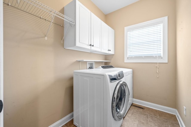 767 Dixie Ln, Pleasant View, TN 37146 - laundry area featuring independent washer and dryer, baseboards, and cabinet space