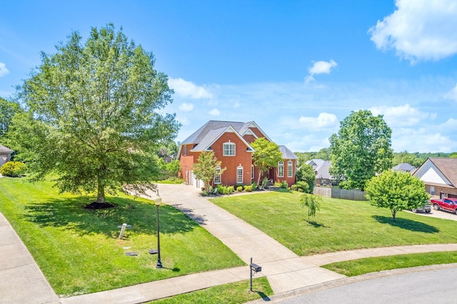 767 Dixie Ln, Pleasant View, TN 37146 - view of front of house featuring concrete driveway, a front yard, and an attached garage
