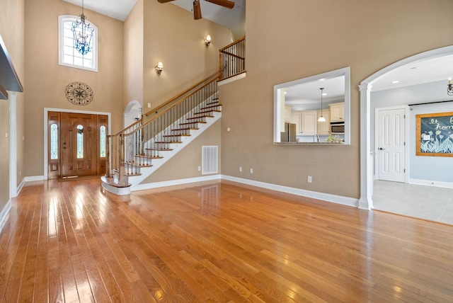 767 Dixie Ln, Pleasant View, TN 37146 - entrance foyer featuring light wood-style floors, a towering ceiling, stairway, and ceiling fan