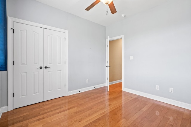 767 Dixie Ln, Pleasant View, TN 37146 - unfurnished bedroom with light wood-type flooring, baseboards, a ceiling fan, and a closet