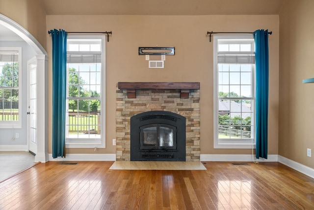 767 Dixie Ln, Pleasant View, TN 37146 - unfurnished living room with wood-type flooring, baseboards, and plenty of natural light